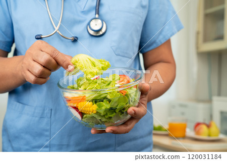 Asian Nutritionist holding healthy food for patient in hospital, nutrition and vitamin. 120031184