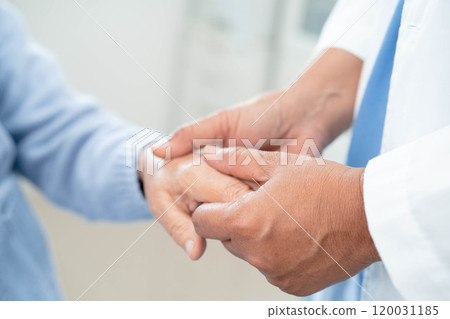 Doctor holding hands Asian elderly woman patient, help and care in hospital. Doctor holding hands Asian elderly woman patient, help and care in hospital. 120031185