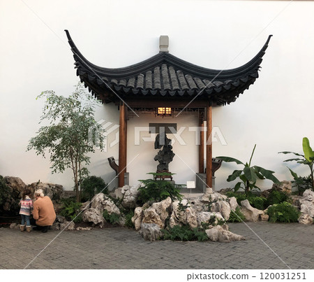 pagoda in Shanghai, China. A beautiful pagoda in Shanghai, China, surrounded by lush greenery and set against a serene backdrop, exuding traditional charm and tranquility pagoda in Shanghai, China. A beautiful pagoda in Shanghai, China, surrounded by lush greenery and set against a serene backdrop, exuding traditional charm and tranquility 120031251