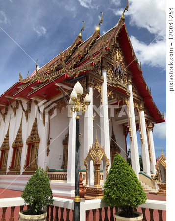 A serene Buddhist temple in Thailand, adorned with intricate architecture, vibrant colors, and tranquil surroundings, where visitors can find inner peace and spirituality. A serene Buddhist temple in Thailand, adorned with intricate architecture, vibrant colors, and tranquil surroundings, where visitors can find inner peace and spirituality. 120031253