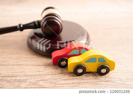 Car accident lawsuit and insurance, Judge hammer with car model. 120031288