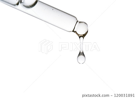 Dropper pipette with delicious serum with bubbles close-up. 120031891