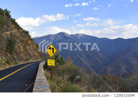 An empty road in the mountains background, view of US natural landscape, Yosemite national park wildlife An empty road in the mountains background, view of US natural landscape, Yosemite national park wildlife 120032094