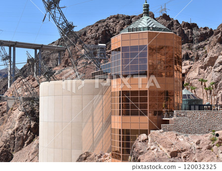 Hoover Dam, Hydroelectric power plant in Clark County, Nevada, industrial construction against the blue sky and mountains 120032325