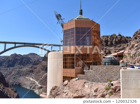 Hoover Dam, Hydroelectric power plant in Clark County, Nevada, industrial construction against the blue sky and mountains Hoover Dam, Hydroelectric power plant in Clark County, Nevada, industrial construction against the blue sky and mountains 120032326
