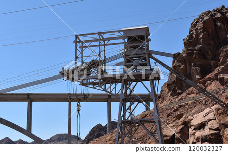 Hoover Dam, Hydroelectric power plant in Clark County, Nevada, industrial construction against the blue sky and mountains Hoover Dam, Hydroelectric power plant in Clark County, Nevada, industrial construction against the blue sky and mountains 120032327