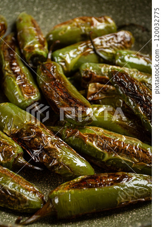 fried padron pepper, in a frying pan, with olive oil, and sea salt, homemade, no people. 120032775