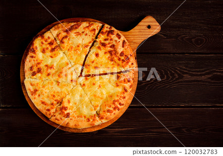 Imereti khachapuri, Traditional Georgian dish, flatbread with cheese, top view, no people, rustic, Imereti khachapuri, Traditional Georgian dish, flatbread with cheese, top view, no people, rustic, 120032783