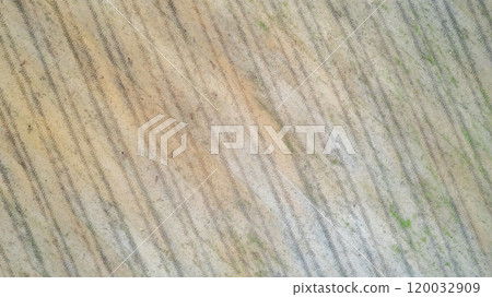 A Stunning Aerial View Showcasing Agricultural Fields with Intricate Patterns and Textures 120032909