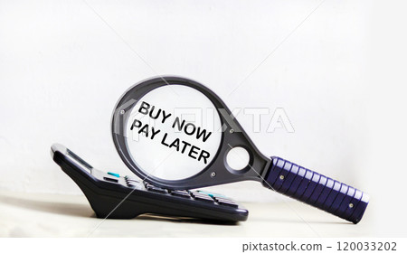 On a white background lies a magnifying glass with the inscription - BUY NOW PAY LATER 120033202