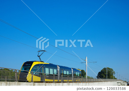 Light line departing from Tobiyama Castle Ruins Station and blue sky - Utsunomiya Light Rail 120033586