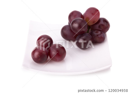 Ripe red grape with leaves isolated on white Ripe red grape with leaves isolated on white 120034938