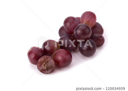 Ripe red grape with leaves isolated on white Ripe red grape with leaves isolated on white 120034939