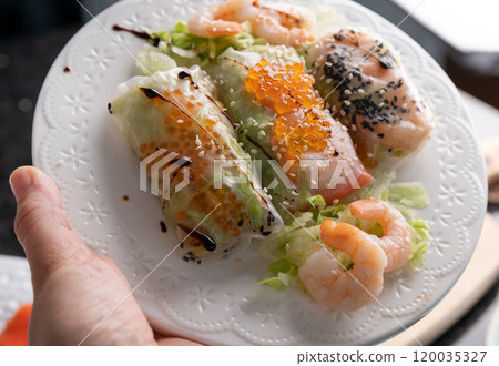 Fresh Seafood Spring Rolls with Shrimp and Caviar Asian Fusion Appetizer. 120035327