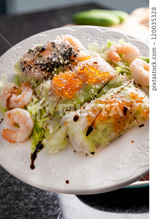 Fresh Seafood Spring Rolls with Shrimp and Caviar Asian Fusion Appetizer. 120035328