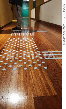 Floor in the museum of the city of Porto, Portugal with raised barriers for the visually impaired. The concept of inclusiveness in public places Floor in the museum of the city of Porto, Portugal with raised barriers for the visually impaired. The concept of inclusiveness in public places 120035597