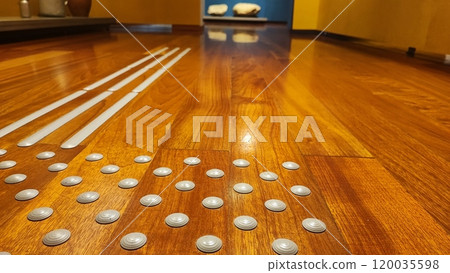 Floor in the museum of the city of Porto, Portugal with raised barriers for the visually impaired. The concept of inclusiveness in public places Floor in the museum of the city of Porto, Portugal with raised barriers for the visually impaired. The concept of inclusiveness in public places 120035598
