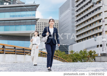 businesswoman walking in office 120035832