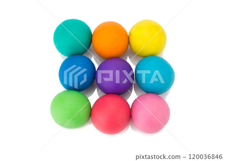 plasticine clay three red yellow green ball on white background closeup 120036846