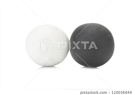 plasticine clay single black and white ball on white background closeup plasticine clay single black and white ball on white background closeup 120036849