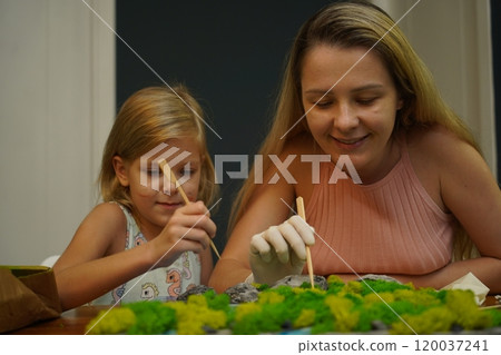 A mother and her daughter craft vibrant natural landscapes A mother and her daughter craft vibrant natural landscapes 120037241