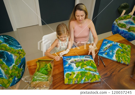A mother and her daughter craft vibrant natural landscapes A mother and her daughter craft vibrant natural landscapes 120037245