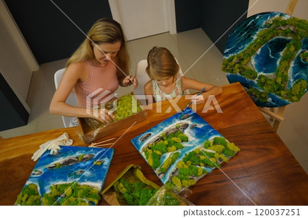 A mother and her daughter craft vibrant natural landscapes A mother and her daughter craft vibrant natural landscapes 120037251