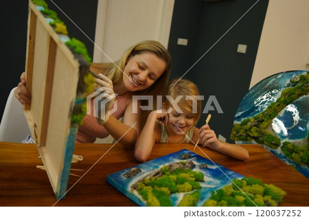 A mother and her daughter craft vibrant natural landscapes A mother and her daughter craft vibrant natural landscapes 120037252