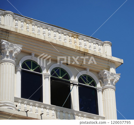Detailed view of windows, doors and balconies of city buildings  120037795