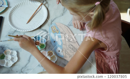 A young mother and her daughter enjoy a creative art session at home A young mother and her daughter enjoy a creative art session at home 120037805