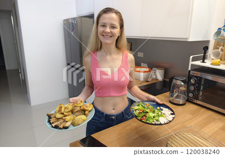 A young woman prepares a fresh meal A young woman prepares a fresh meal 120038240