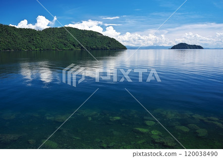 Lake Biwa under the blue summer sky. View of Takeo Island from the north shore of Lake Biwa. Lake Biwa under the blue summer sky. View of Takeo Island from the north shore of Lake Biwa. 120038490