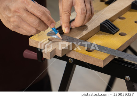 Senior man Cutting Dovetails With Woodworking Hand Tool for Hobby After retirement. Senior man Cutting Dovetails With Woodworking Hand Tool for Hobby After retirement. 120039327