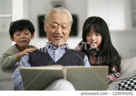 asian grandpa and two grandchildren having a good time at home asian grandpa and two grandchildren having a good time at home 120040098