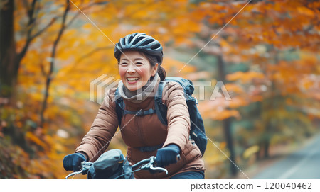 Senior woman enjoying cycling Senior woman enjoying cycling 120040462