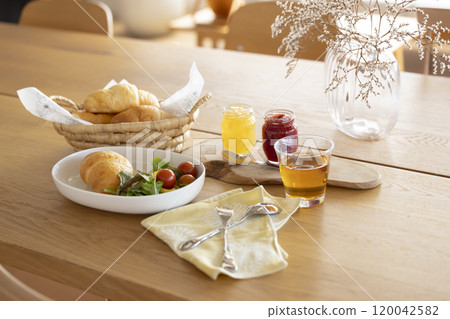 Breakfast: Bread and salad on the table 120042582