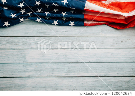 Veterans Day celebration concept, American flags on wooden background, symbolizing honor, pride, and democracy. November 11 is a day to honor our veterans. Veterans Day celebration concept, American flags on wooden background, symbolizing honor, pride, and democracy. November 11 is a day to honor our veterans. 120042684