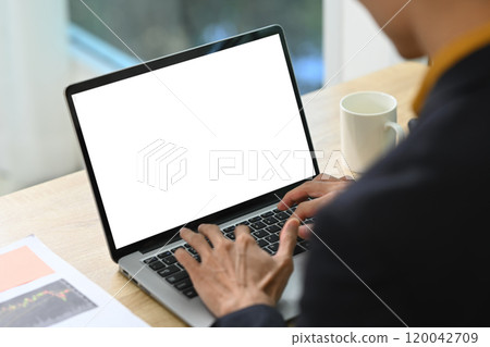 Close up of businessman hands typing on laptop keyboard Close up of businessman hands typing on laptop keyboard 120042709
