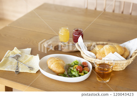 Breakfast: Bread and salad on the table 120043423