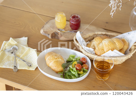 Breakfast: Bread and salad on the table 120043426