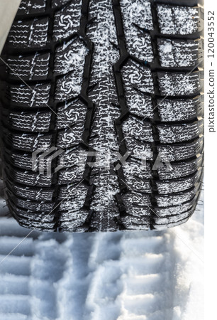 Tire tracks in the snow 120043552