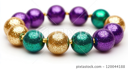 Colorful beaded circular arrangement featuring green purple gold beads for festive decoration 120044188