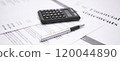Financial statement review with calculator and pen emphasizing numbers and data analysis 120044890