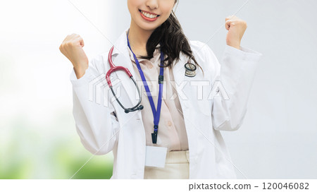 Female medical staff doing a fist pump Female medical staff doing a fist pump 120046082