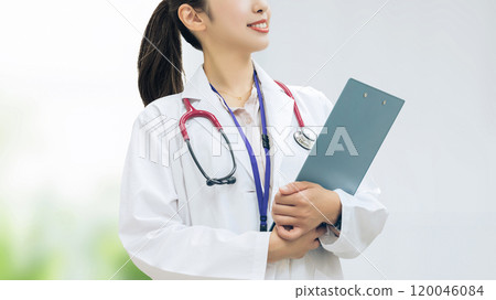 Female medical staff holding a binder Female medical staff holding a binder 120046084