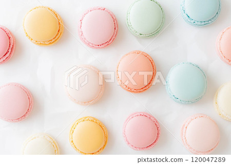 Colorful and various flavors of macarons with copy space on a solid background. 120047289