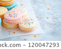 Colorful and various flavors of macarons with copy space on a solid background. 120047293