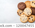 Top view of chocolate chip cookies on a solid background. 120047455
