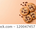 Top view of chocolate chip cookies on a solid background. 120047457