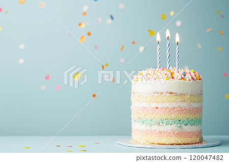 A pastel birthday cake with a light blue background and copy space. 120047482
